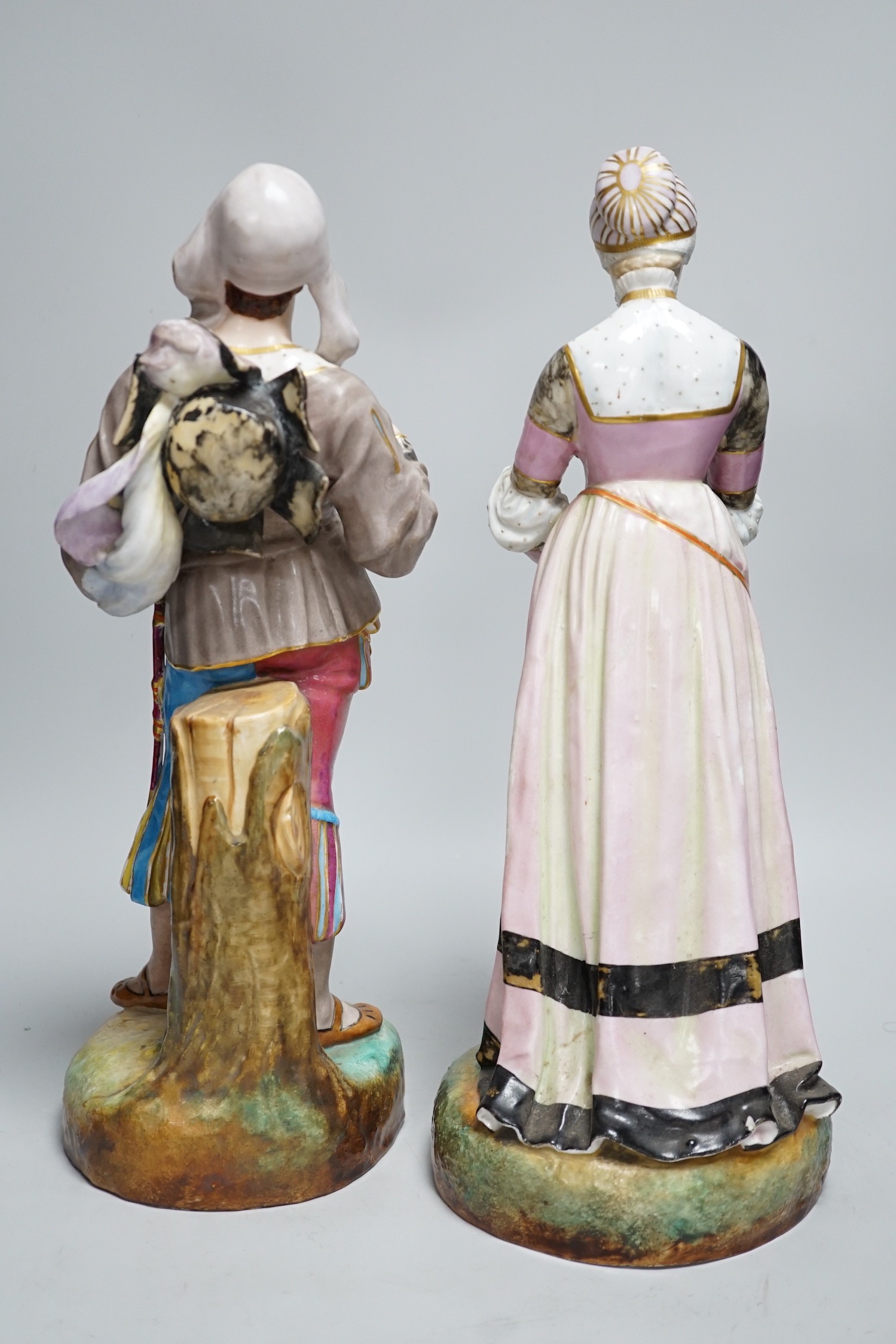 A pair of large Paris porcelain figures of a gentleman and a lady, lady 41cms high